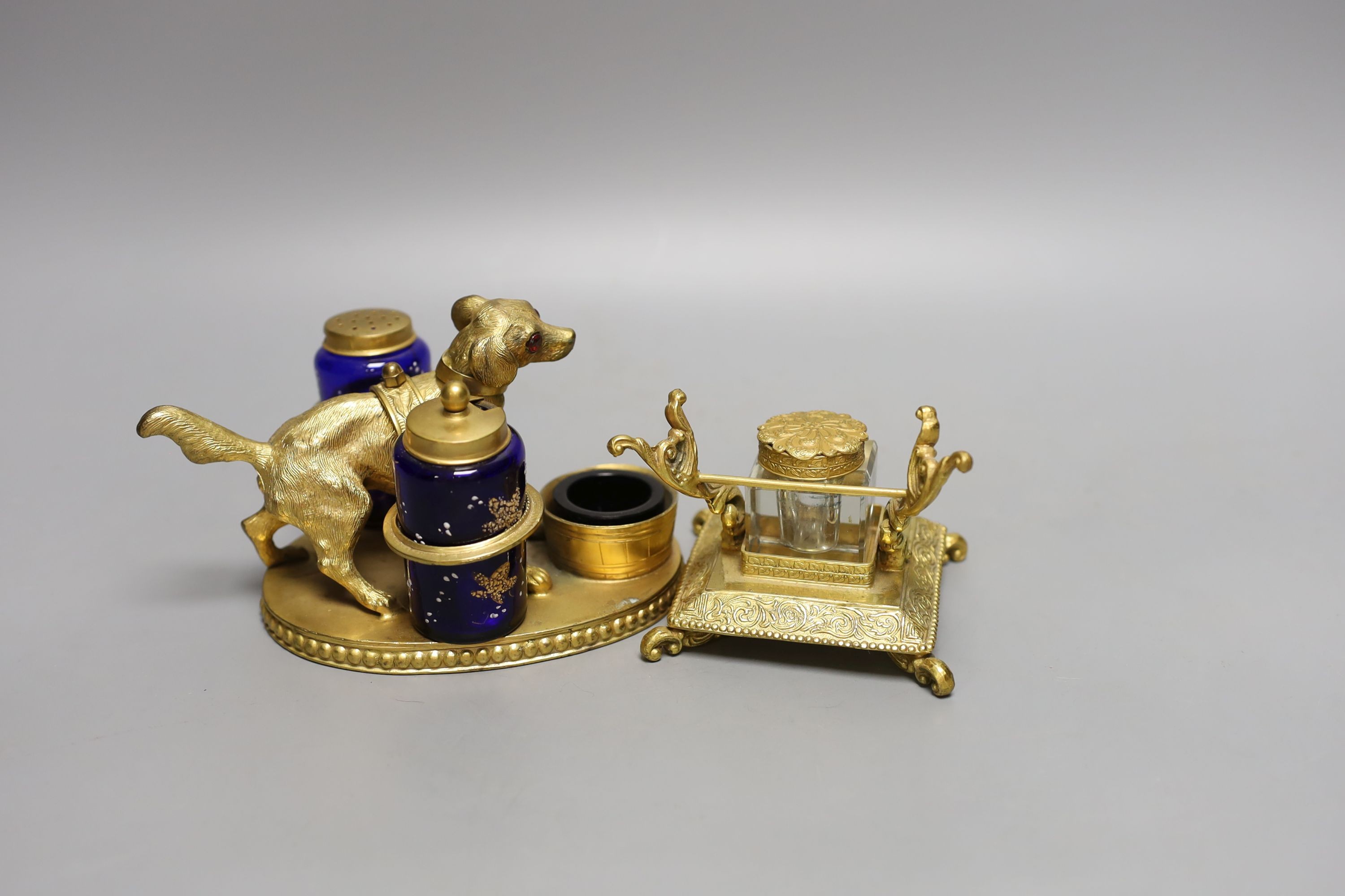 A gilt metal ‘dog’ desk stand together with a similar French style inkwell. Longest 15cm